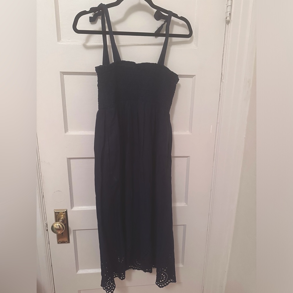 Navy blue cotton midi sundress with smocking and tie straps.
